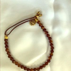 Michael Kors brown and black bracket with emblem